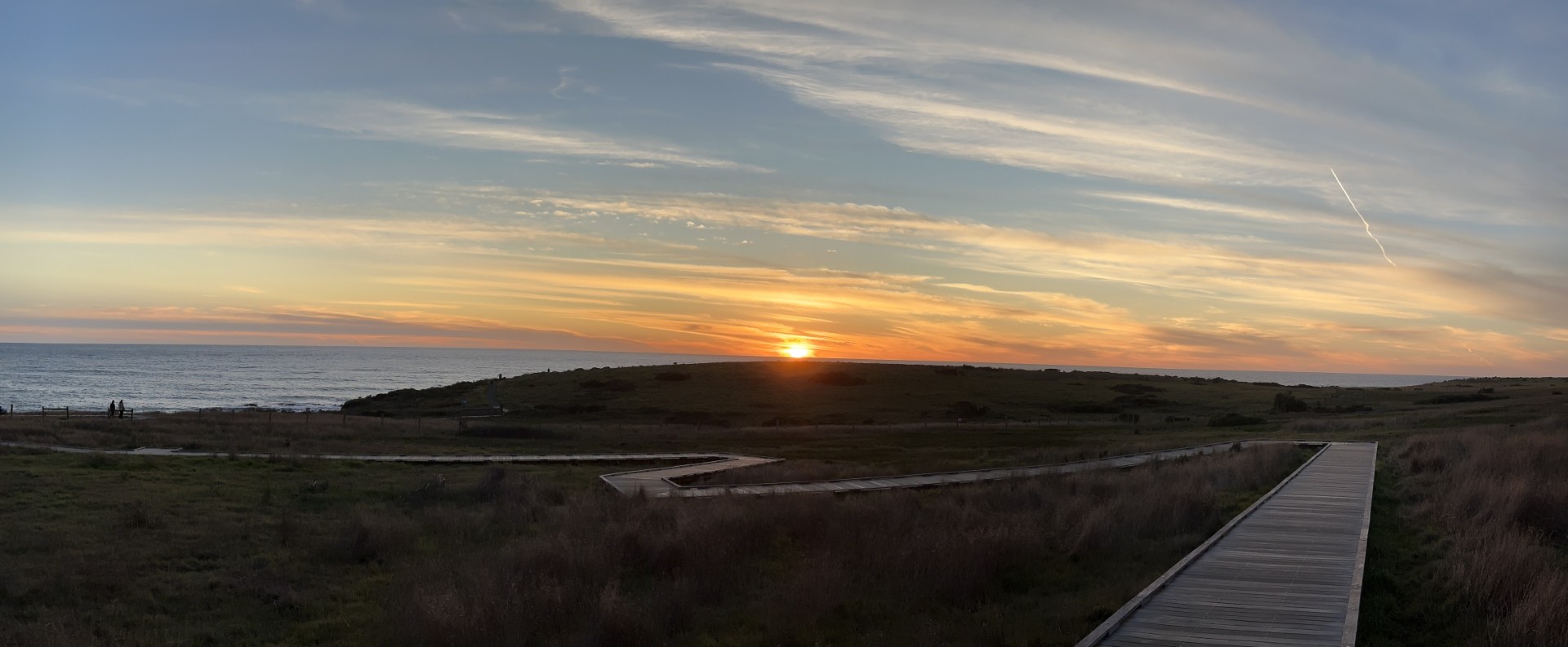 sunset over the boardwalk